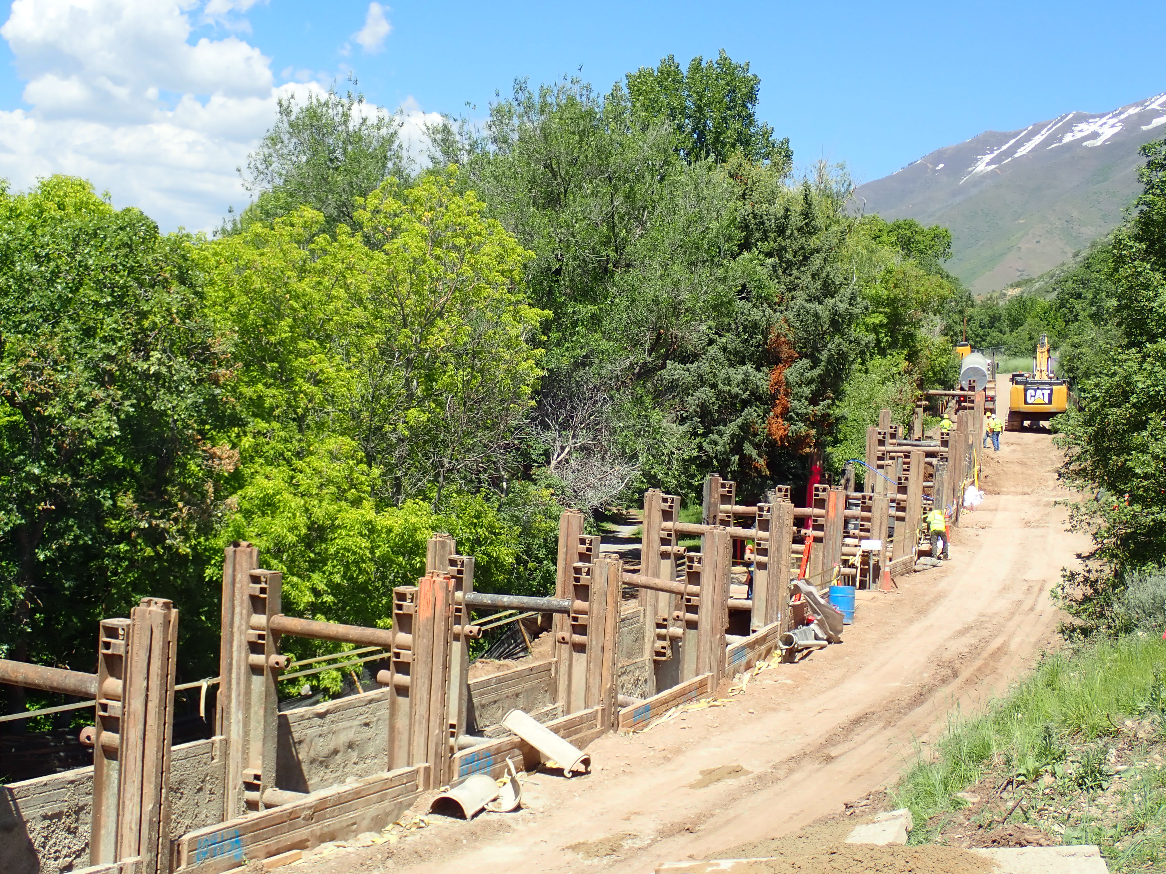 Forms in a trench to lay pipe on the side of a road