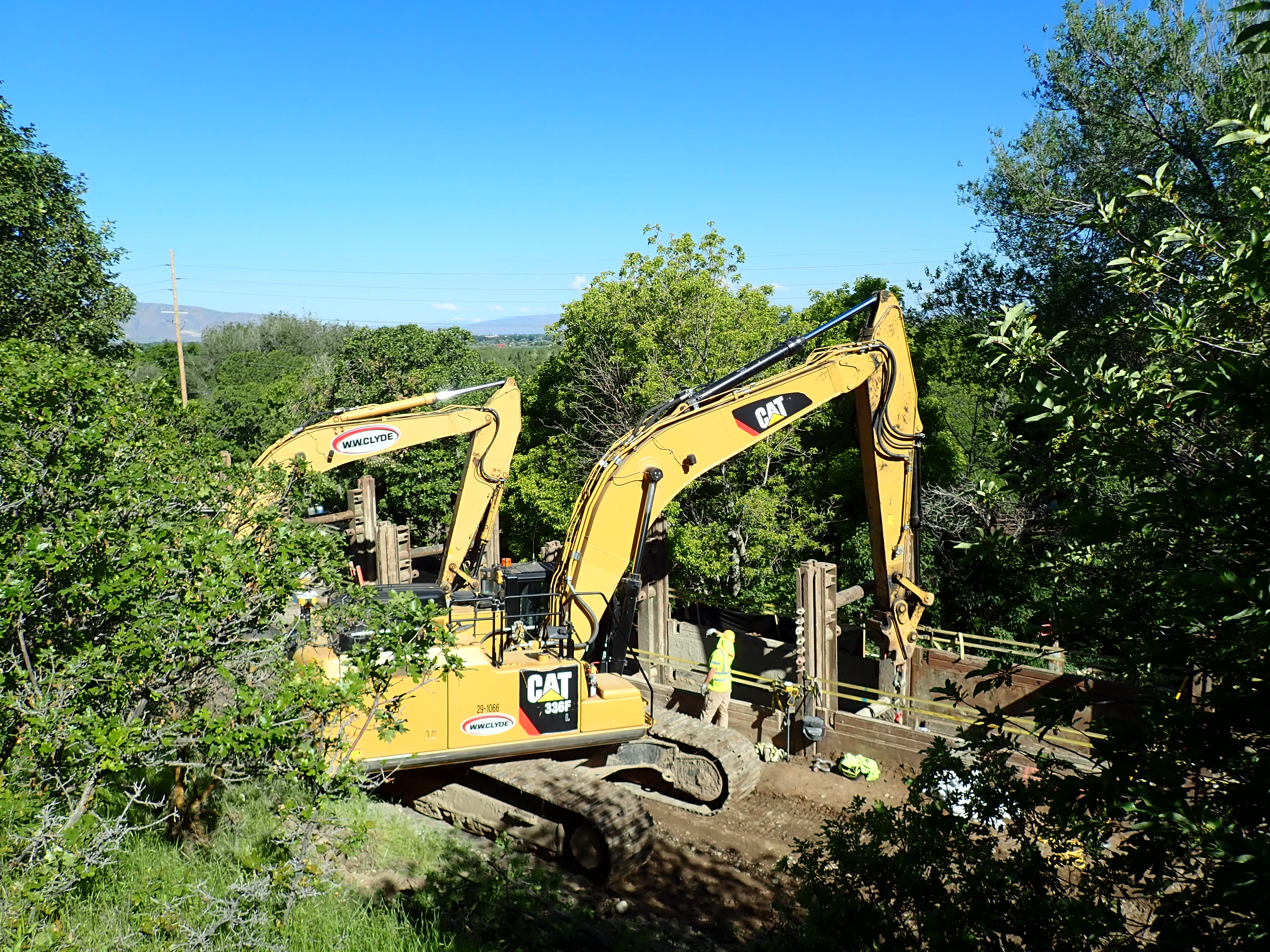 CAT tractor equipment digging in a trench
