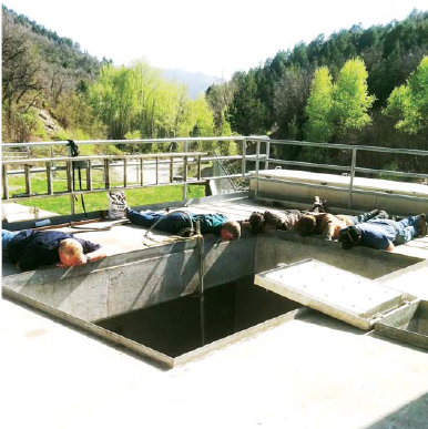 District staff inspecting sixth water flow control structure